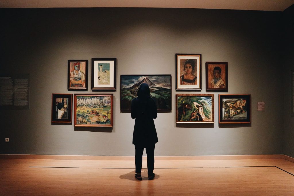 Woman admiring art in an art gallery